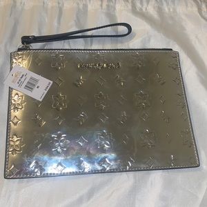 Micheal Kors Silver traveling clutch